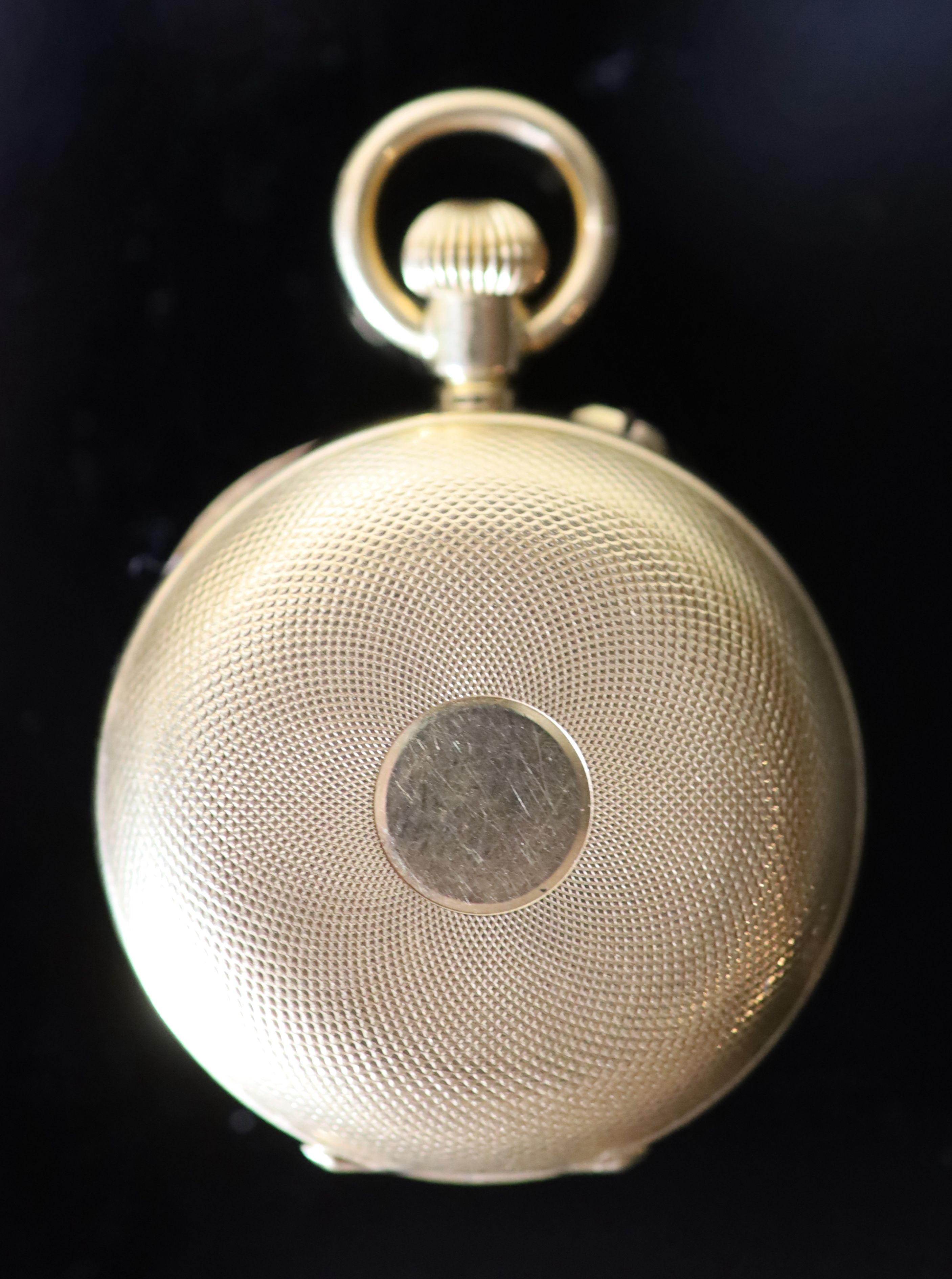 An early 20th century Swiss engine turned 18k gold hunter keyless fob watch,